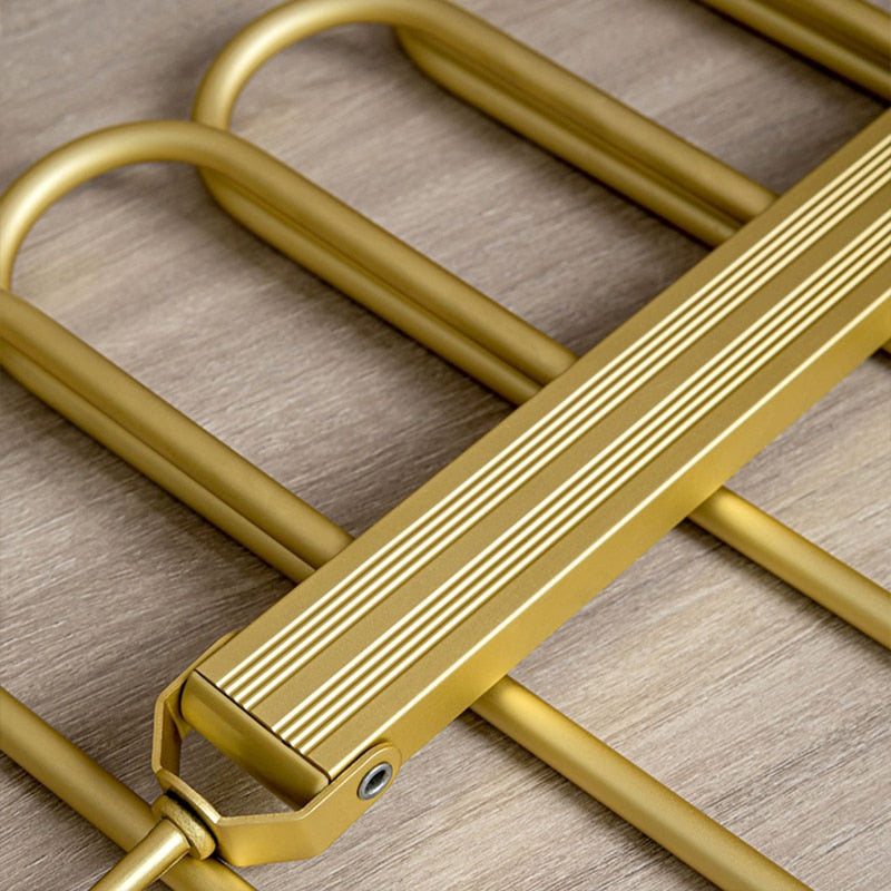 Cintre porte-pantalons pivotant en aluminium doré pour 6 pantalons avec barres antidérapantes gain de place | Koossa