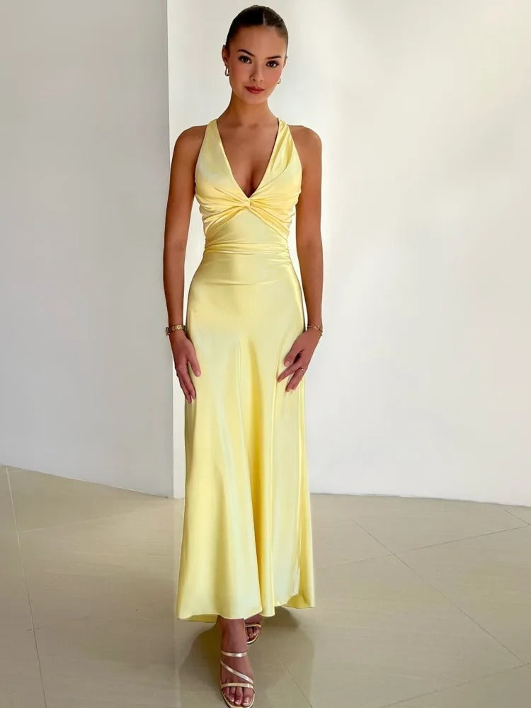 Floor-Length Backless Evening Gown in Radiant Yellow for Festive Occasions | Flowing Criss-Cross Back Formal Dress with Deep V Neckline and Waist Tie Detailing | Koossa