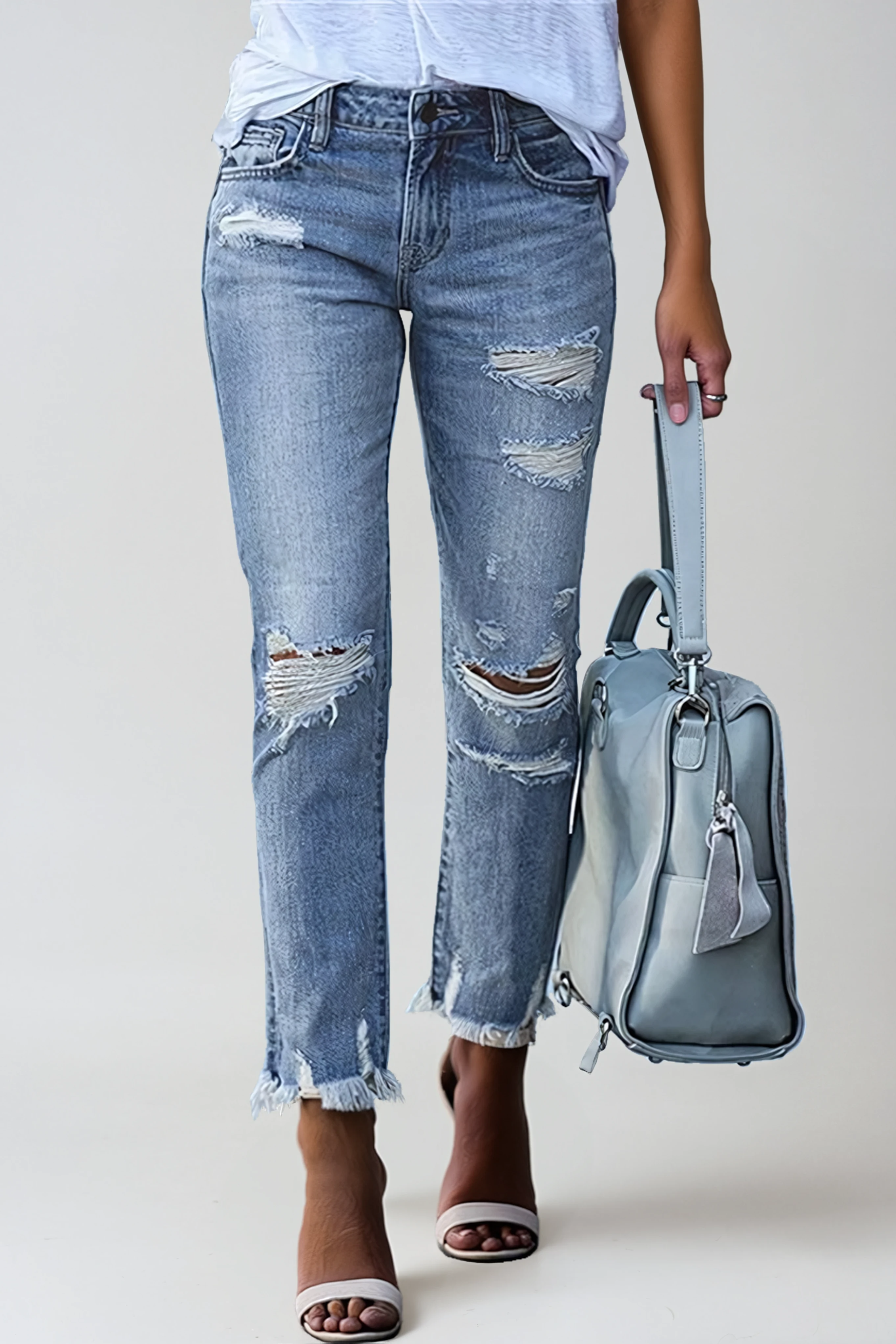 Straight Leg Jeans with Distressed Detail and Raw Hem in Light Blue | Timeless Denim Classic Casual Weekend Wear Five Pocket Design | Koossa